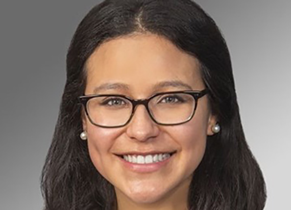 A headshot of Arriana Arroyo smiling wearing glasses